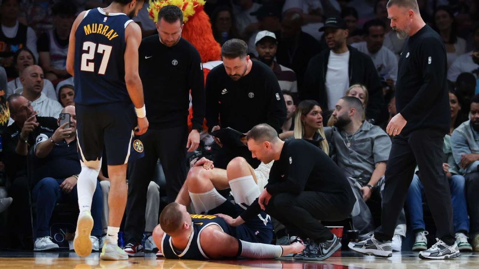 Nikola Jokic clutching knee