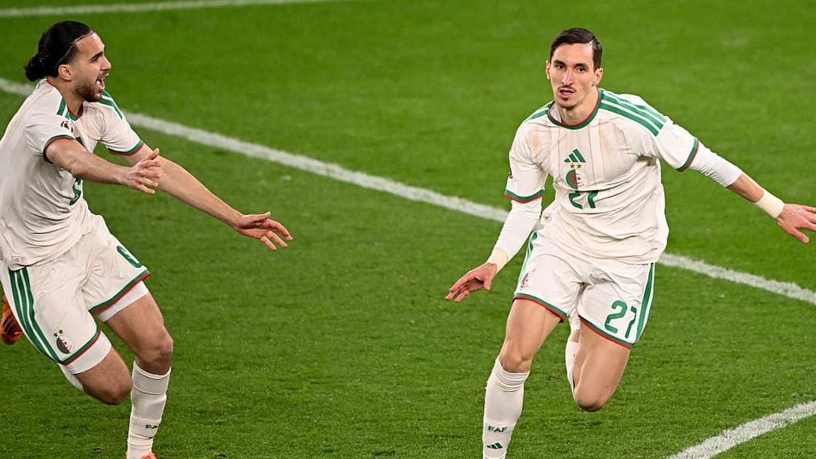 Football players celebrating a goal