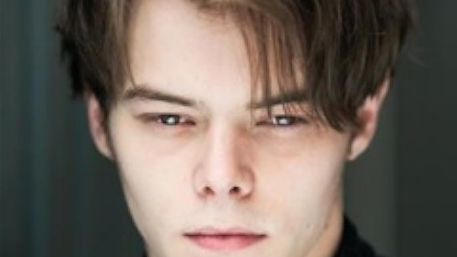 Charlie Heaton in a dark suit