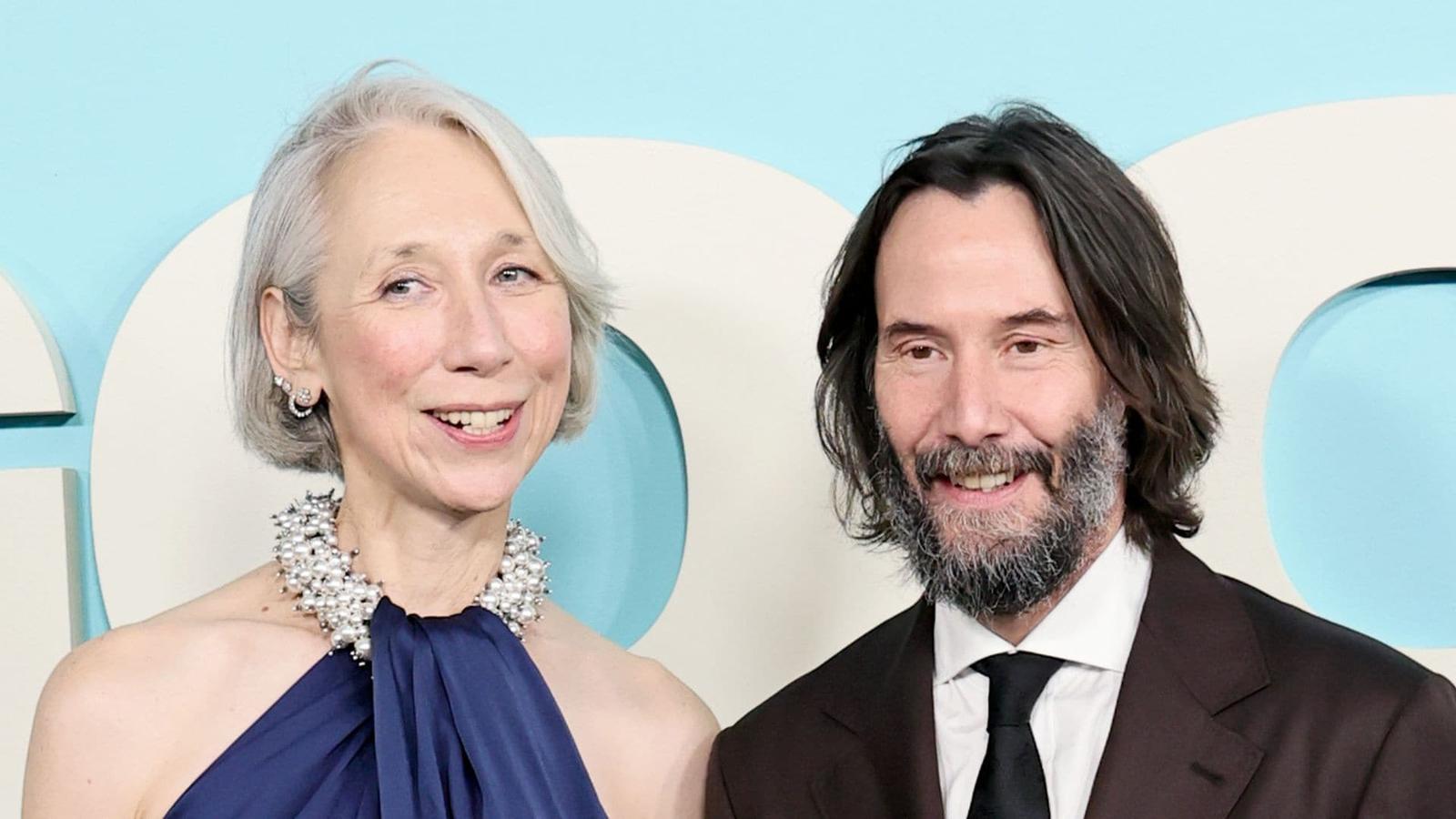 Keanu Reeves and Alexandra Grant ice skating