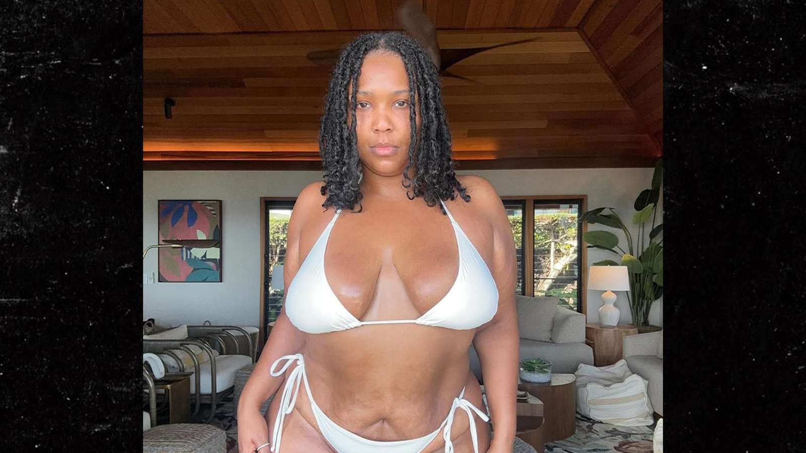 Lizzo posing white bikini