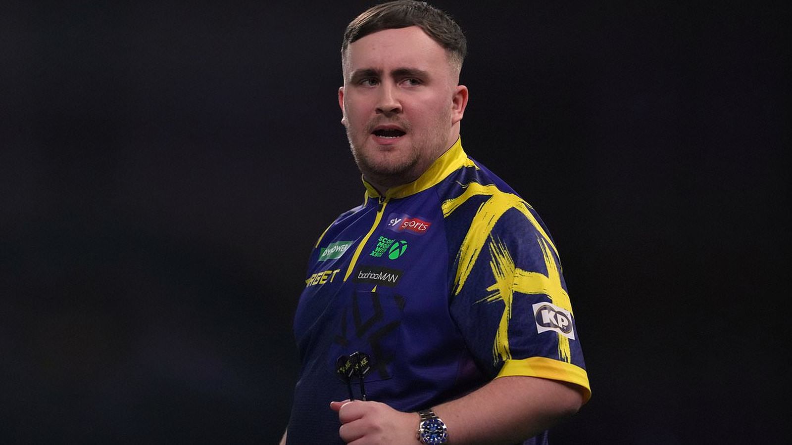 Luke Littler throws dart