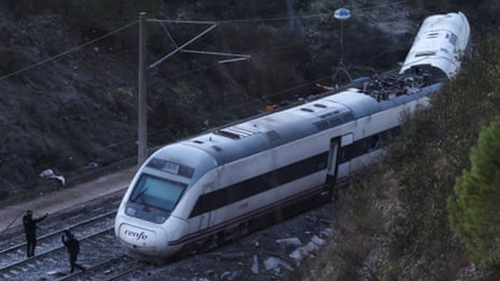 Damaged train carriages after collision
