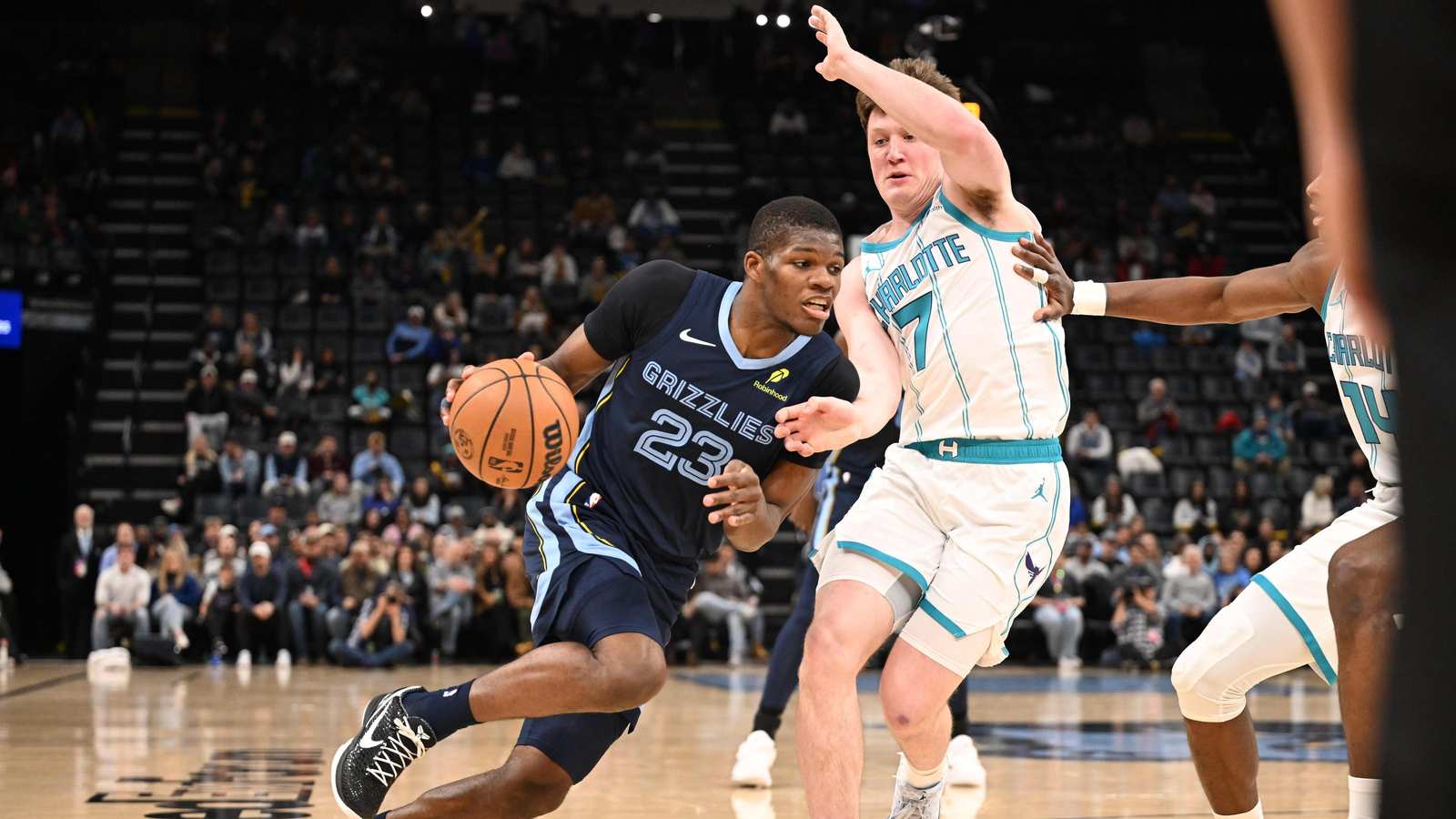Basketball player holding knee in pain