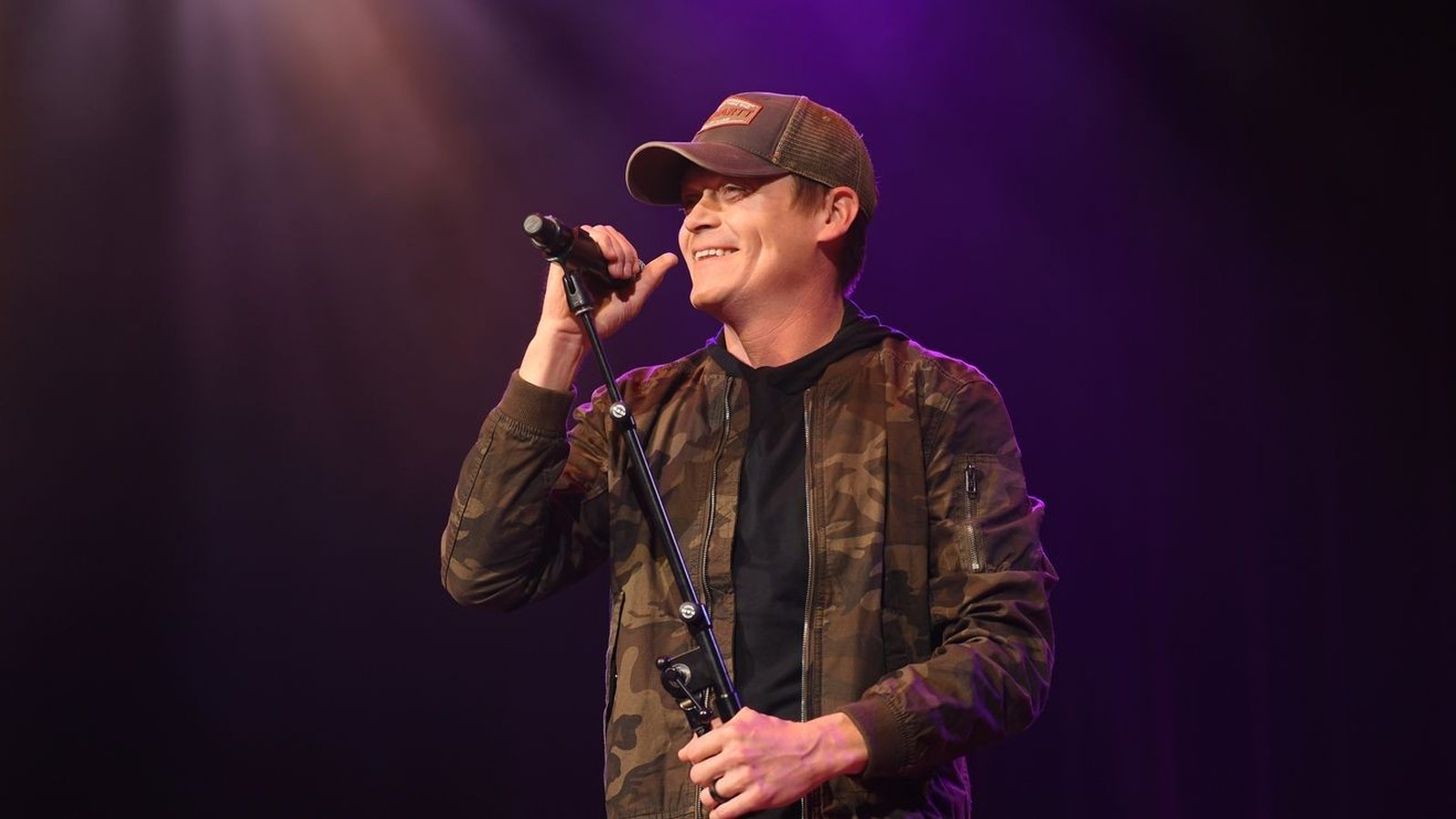 Brad Arnold performing on stage