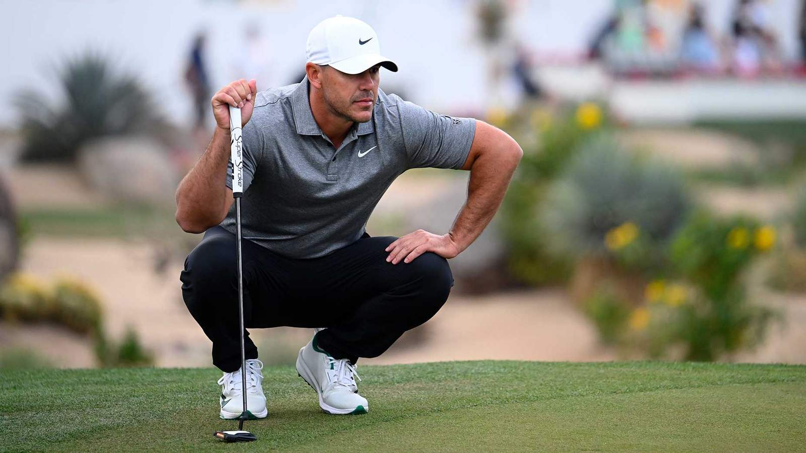 Brooks Koepka golfing on a green