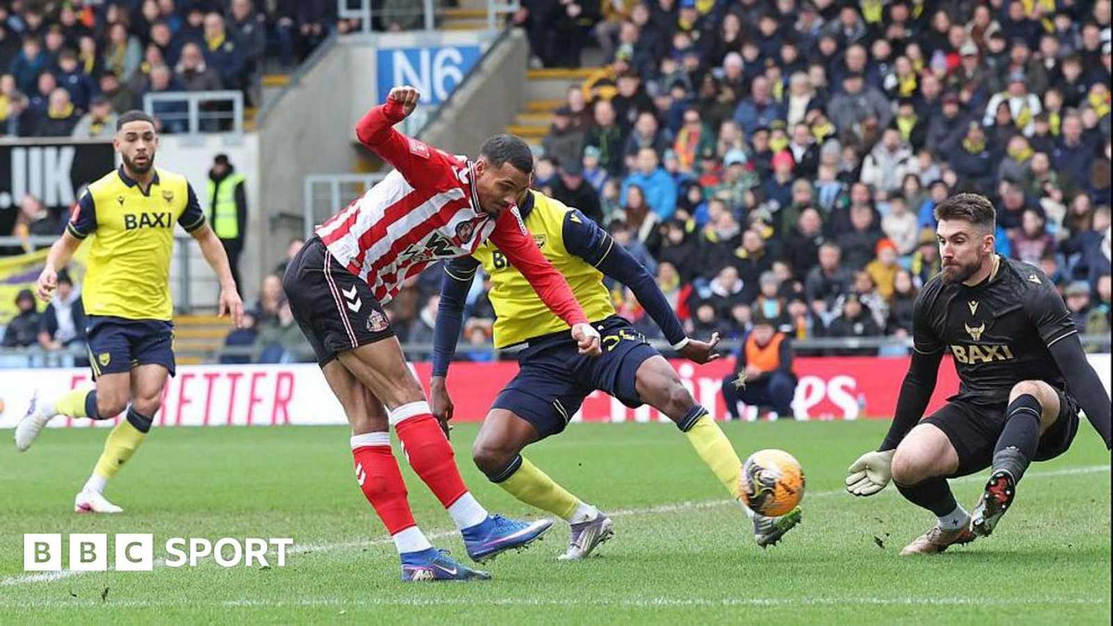 Two football players contesting the ball