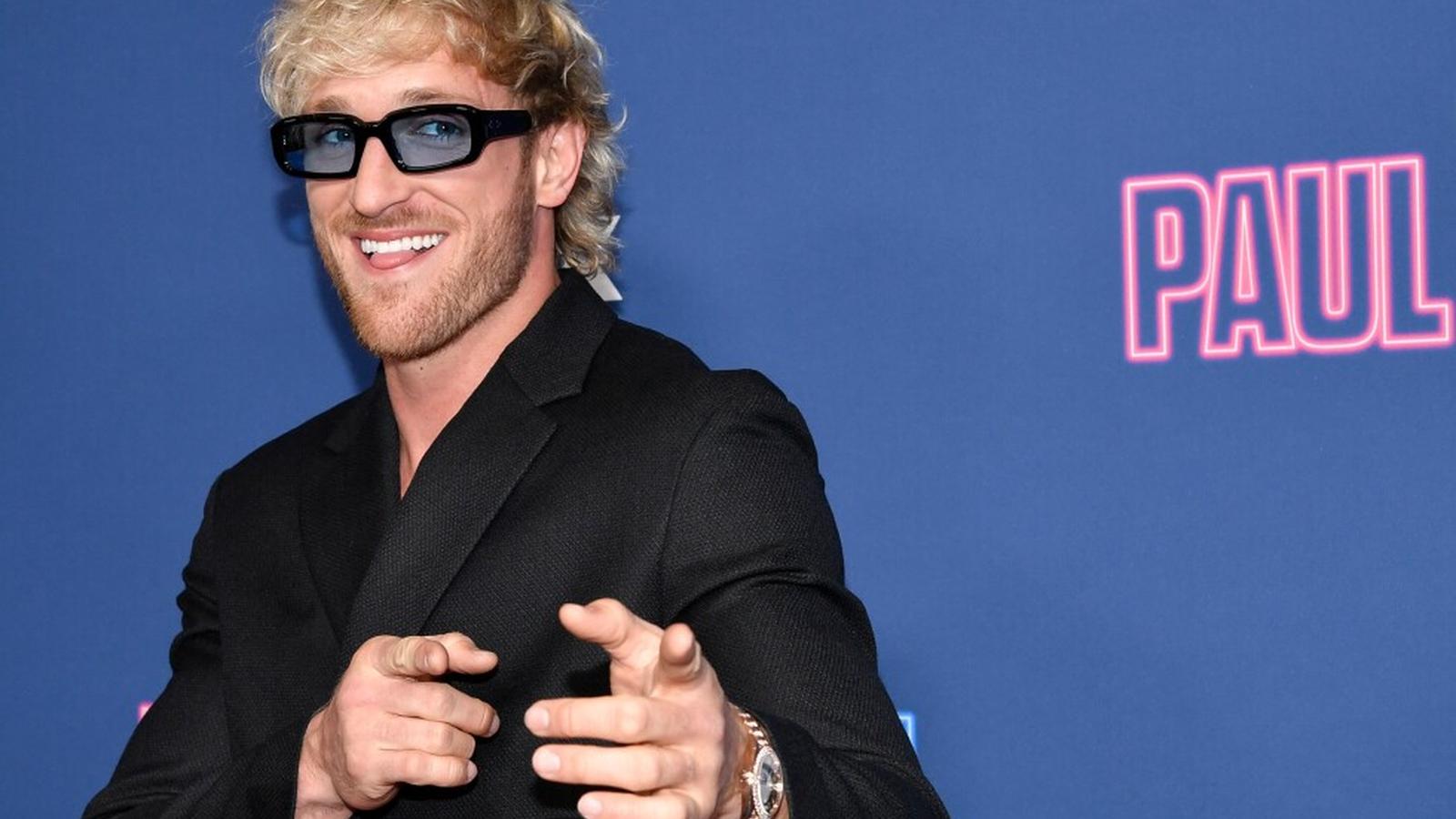 Logan Paul holding rare Pikachu Illustrator Pokémon card