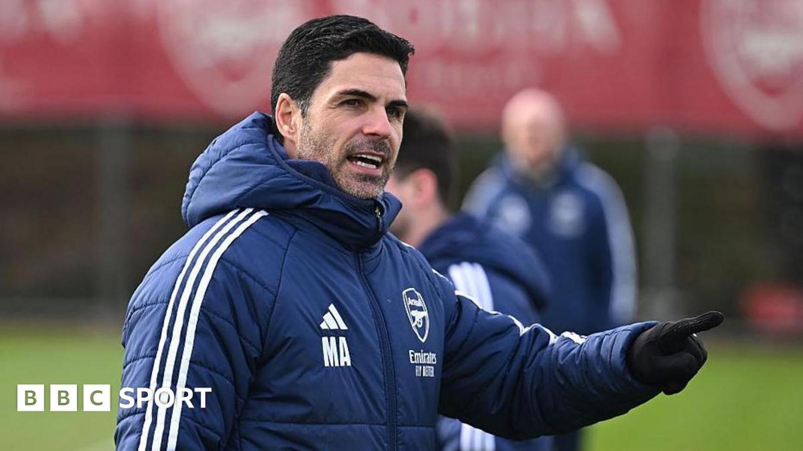 Mikel Arteta in car with crowd