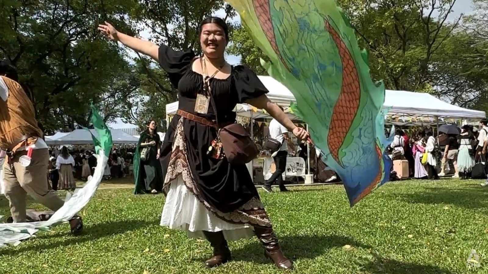People in fantasy costumes at fair