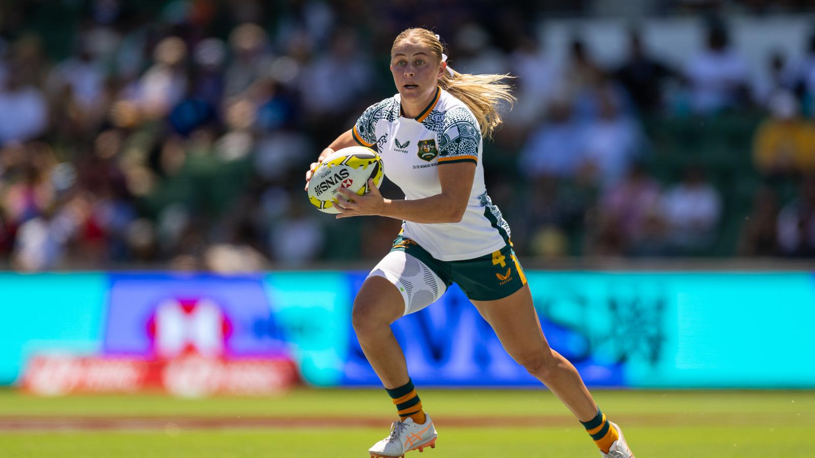 Rugby players in action on field