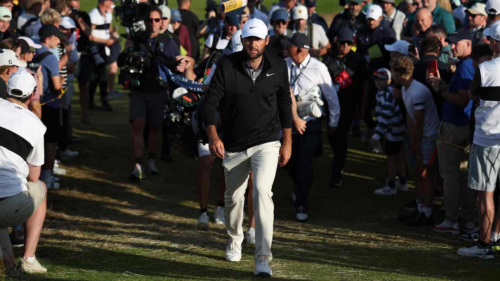 Scottie Scheffler preparing to swing a golf club