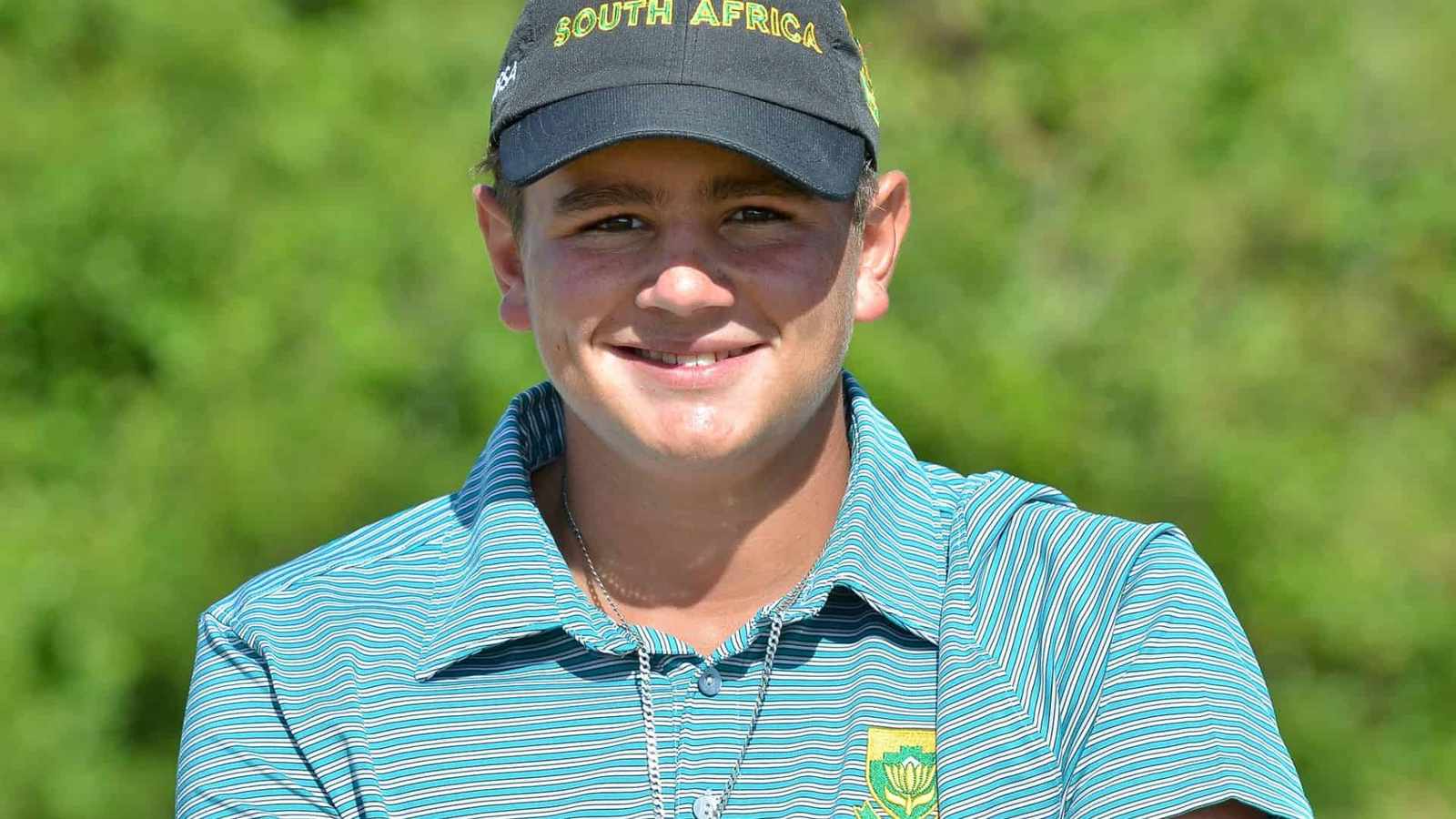 Casey Jarvis playing golf on a course