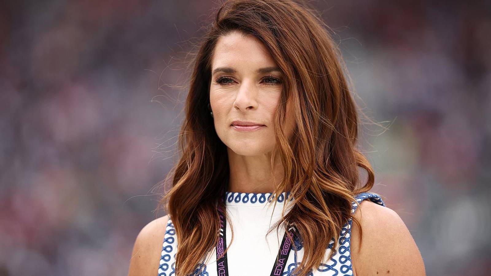 Danica Patrick speaking into microphone