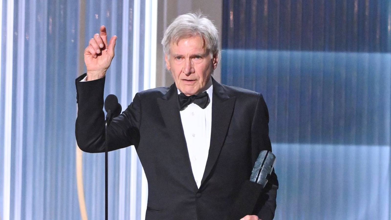 Harrison Ford holding award