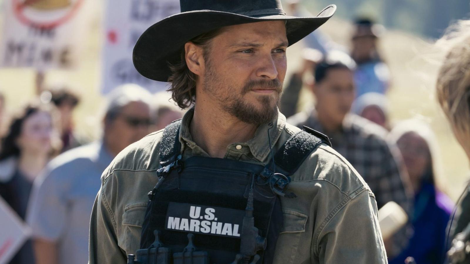 Kayce Dutton wearing U.S. Marshal badge