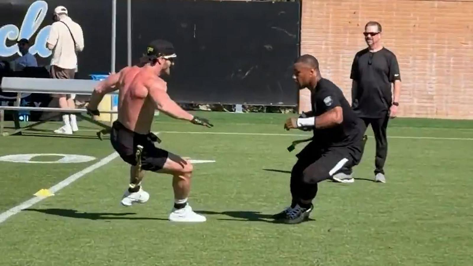 Logan Paul and Saquon Barkley on field