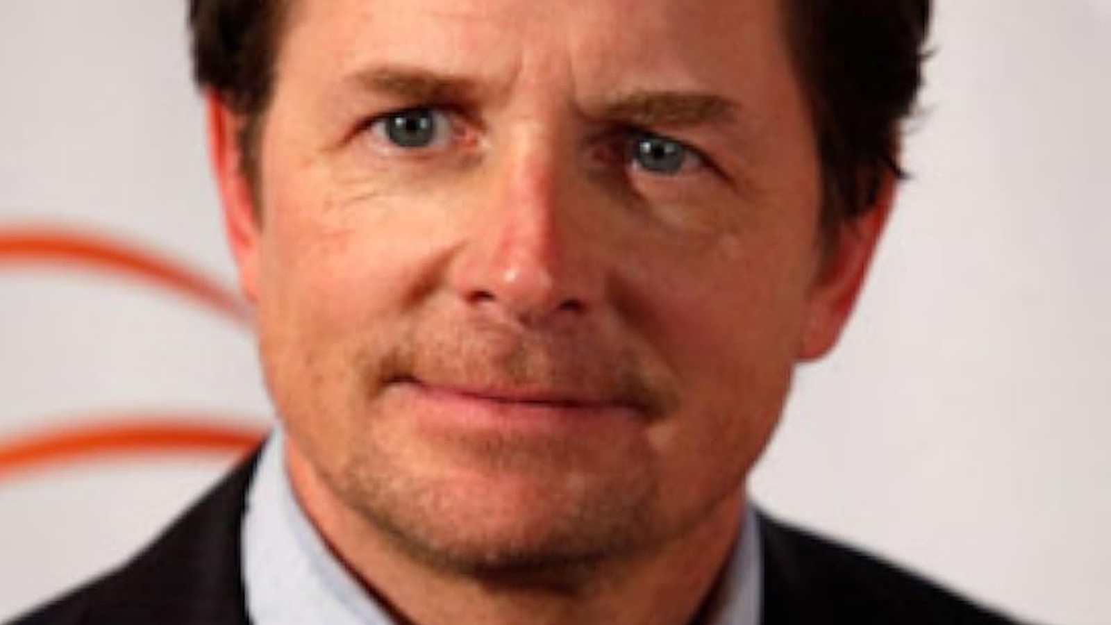 Michael J. Fox speaking at an awards ceremony