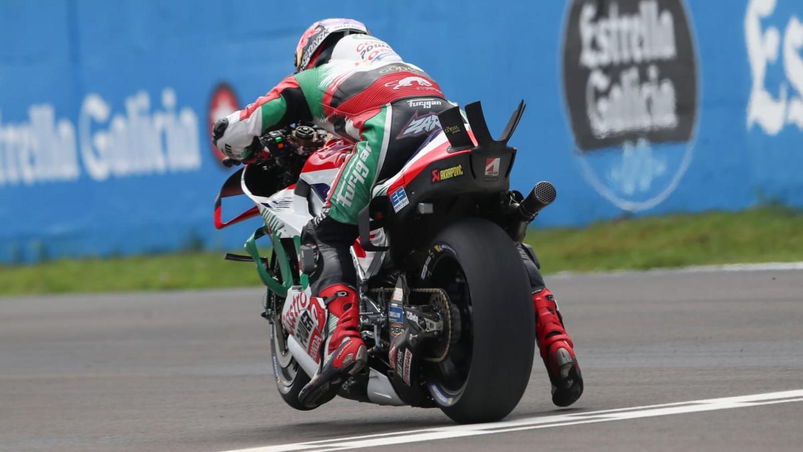 Motorcycle racing in rain