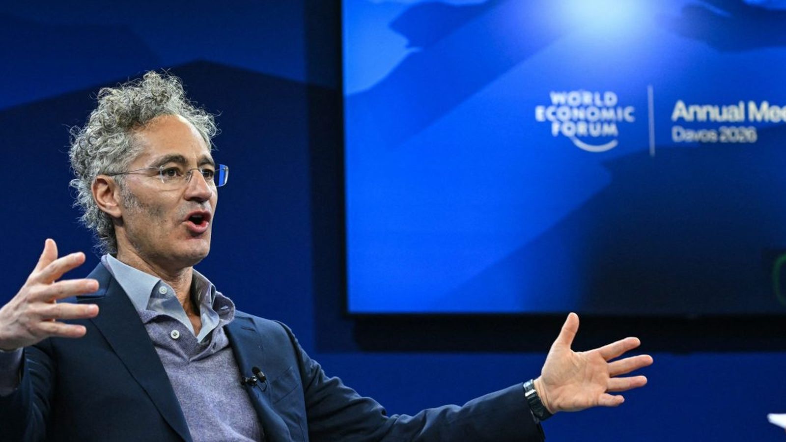 Palantir CEO Alex Karp gesturing while speaking at the World Economic Forum in Davos