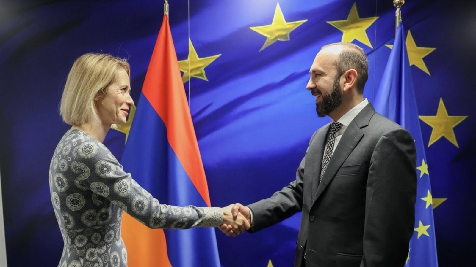Armenian Foreign Minister Ararat Mirzoyan shaking hands with Estonian Prime Minister Kaja Kallas