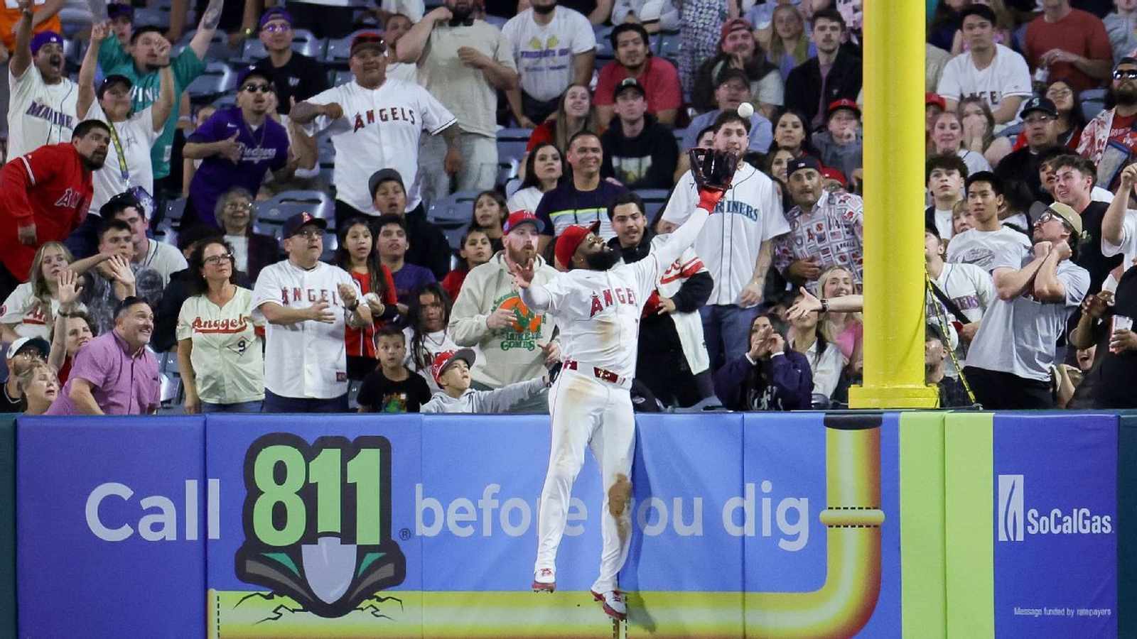 Jo Adell leaping for baseball