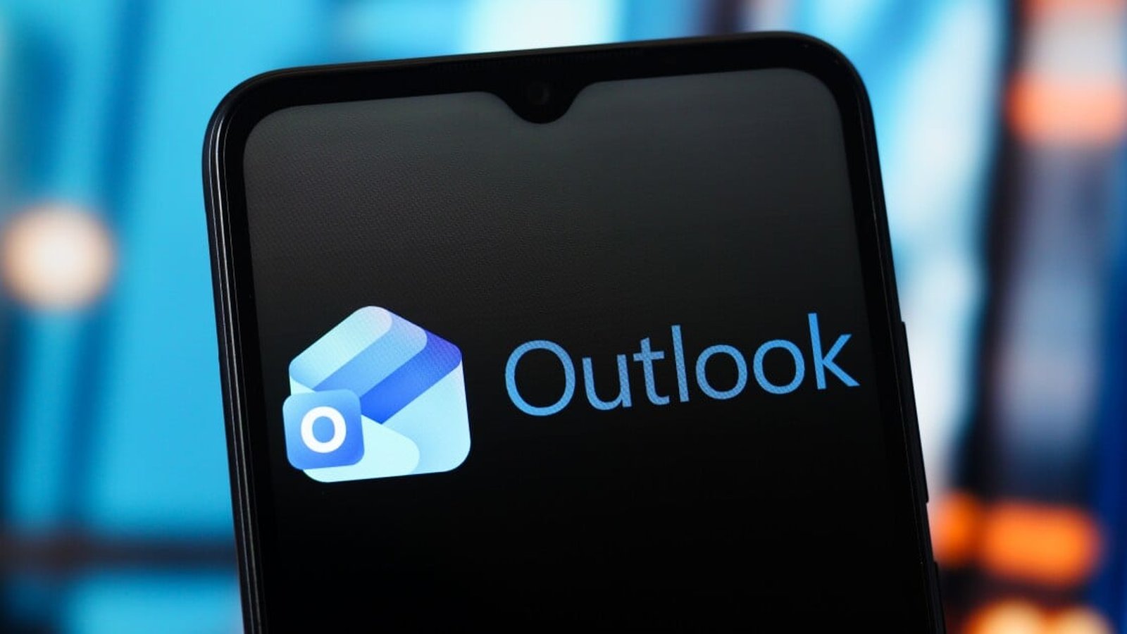 The Microsoft Outlook logo displayed on a black smartphone screen against blue background