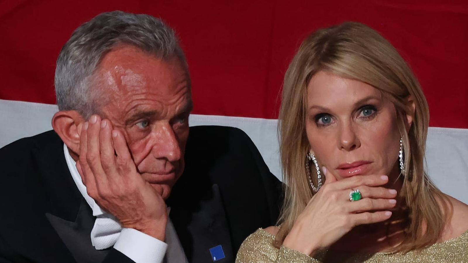 Robert F Kennedy Jr and Cheryl Hines sitting together with serious expressions