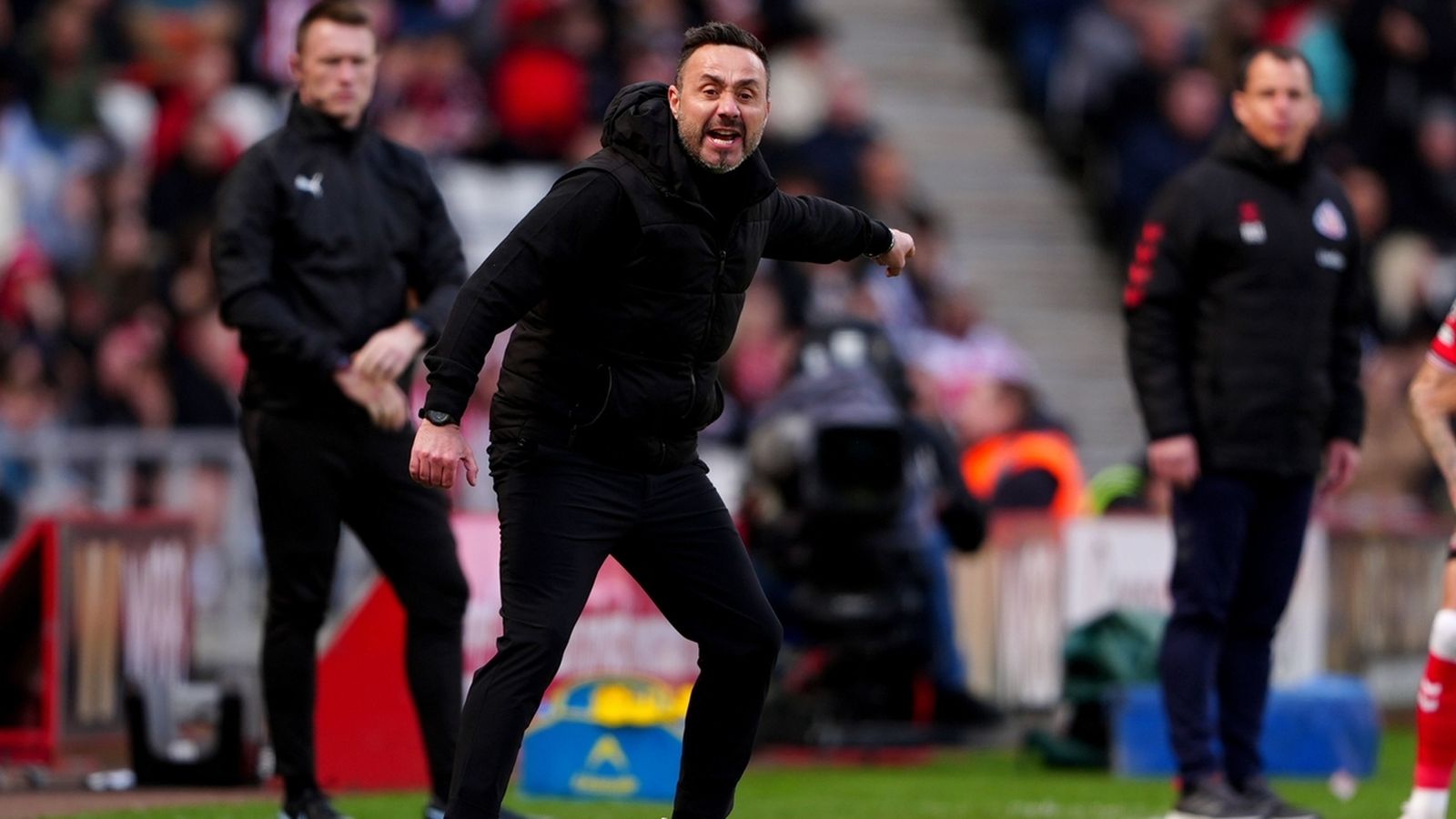 Tottenham manager Roberto De Zerbi shouting instructions from the sidelines during a match