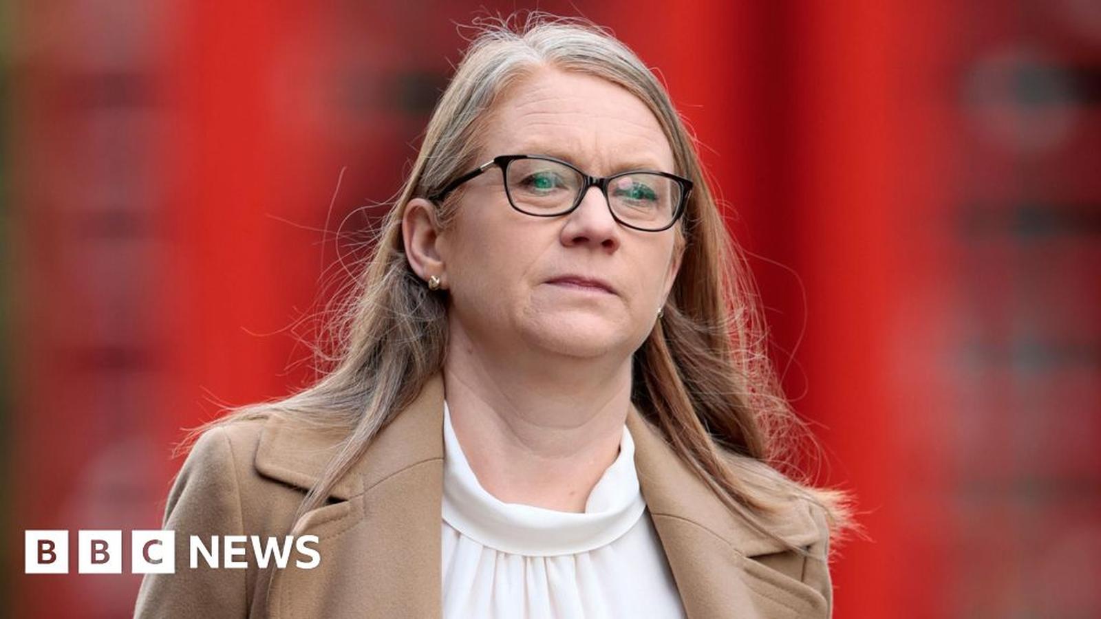Scottish Cabinet Secretary for Finance Shona Robison wearing glasses and a tan coat