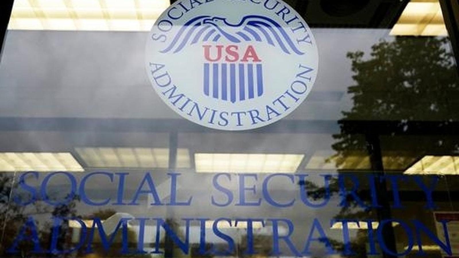 The Social Security Administration logo displayed on a glass office building window.