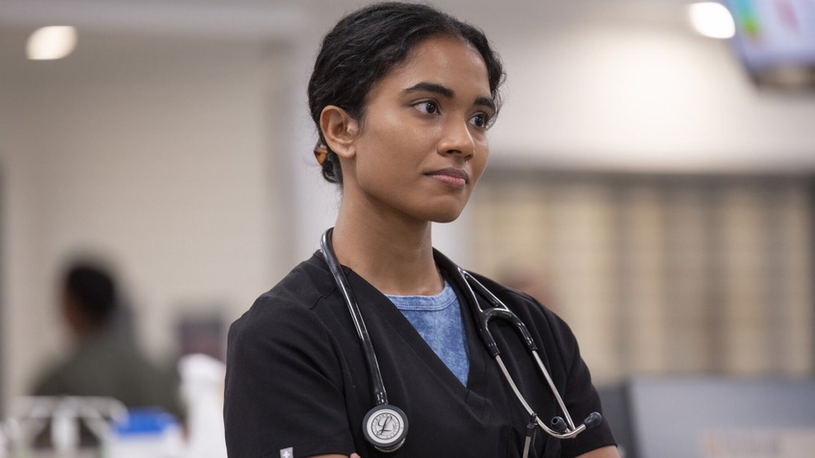 Actress Supriya Ganesh wearing a medical scrub top and stethoscope in a hospital