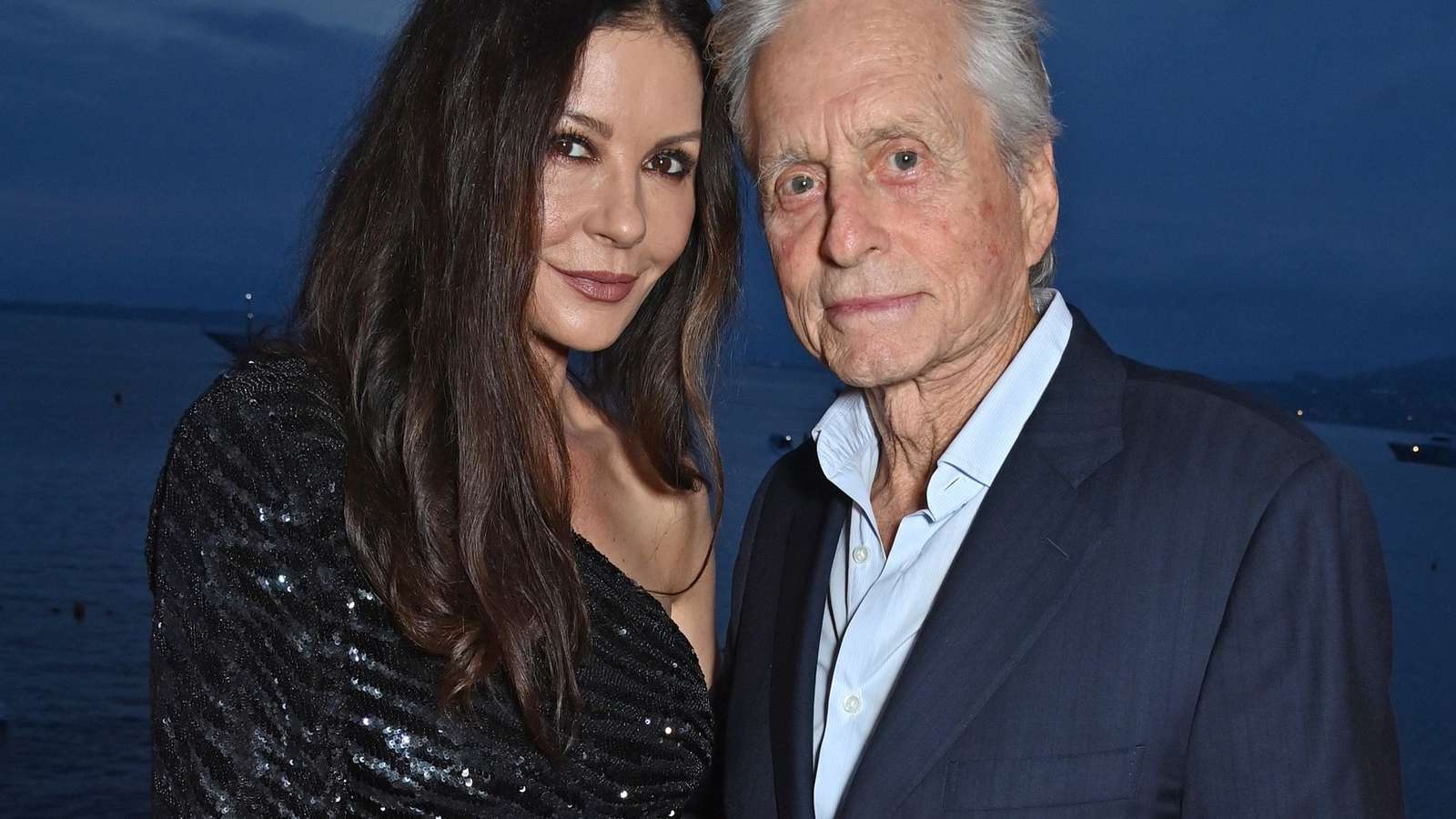 Catherine Zeta-Jones and Michael Douglas posing together at an evening event