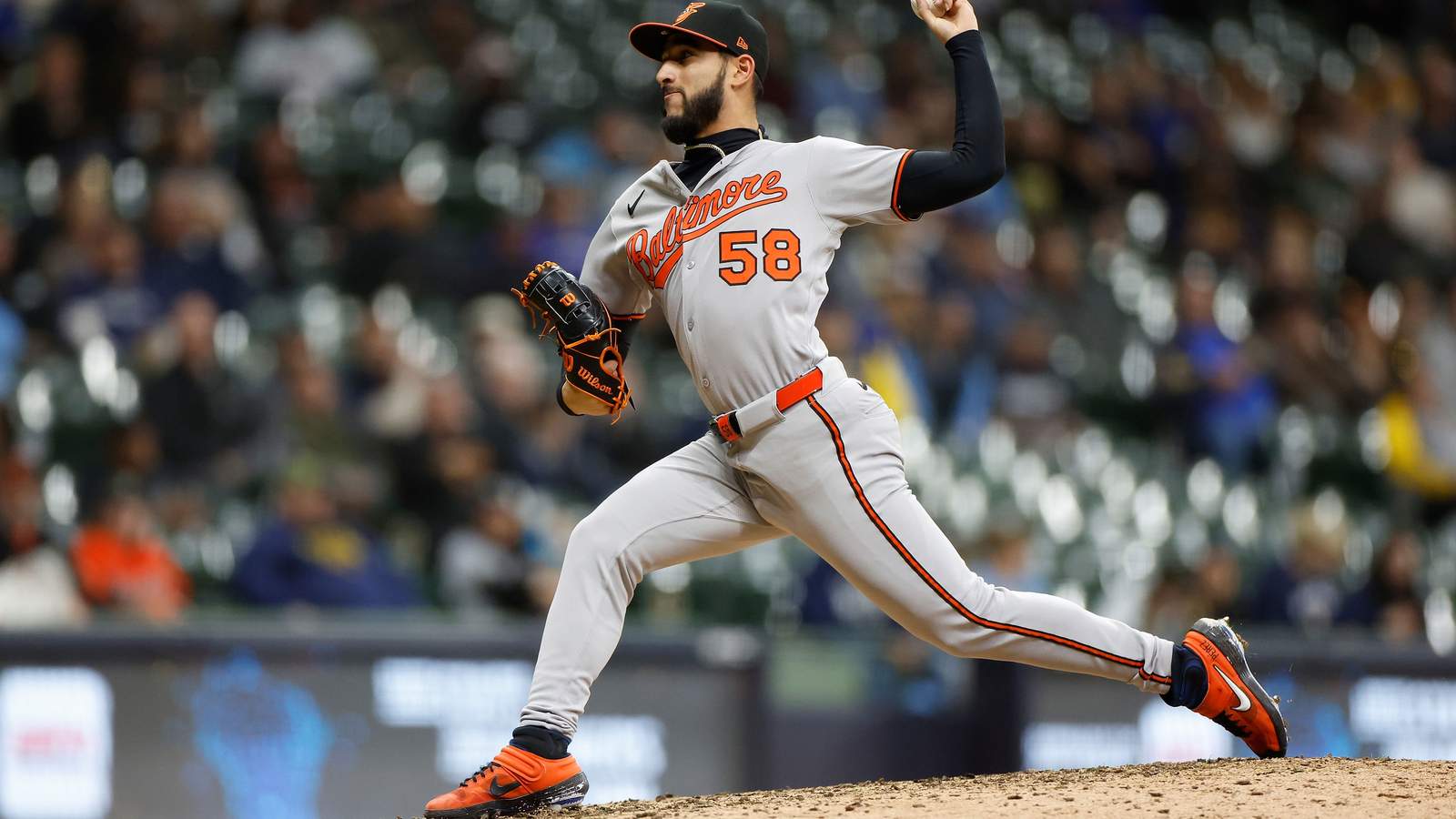 Baltimore Orioles pitcher Cionel Pérez in his windup delivering a pitch on the mound