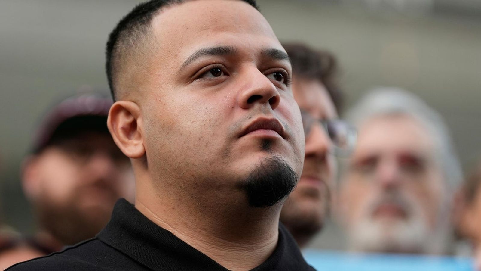 Kilmar Abrego Garcia looking upward with a serious expression during a court proceeding