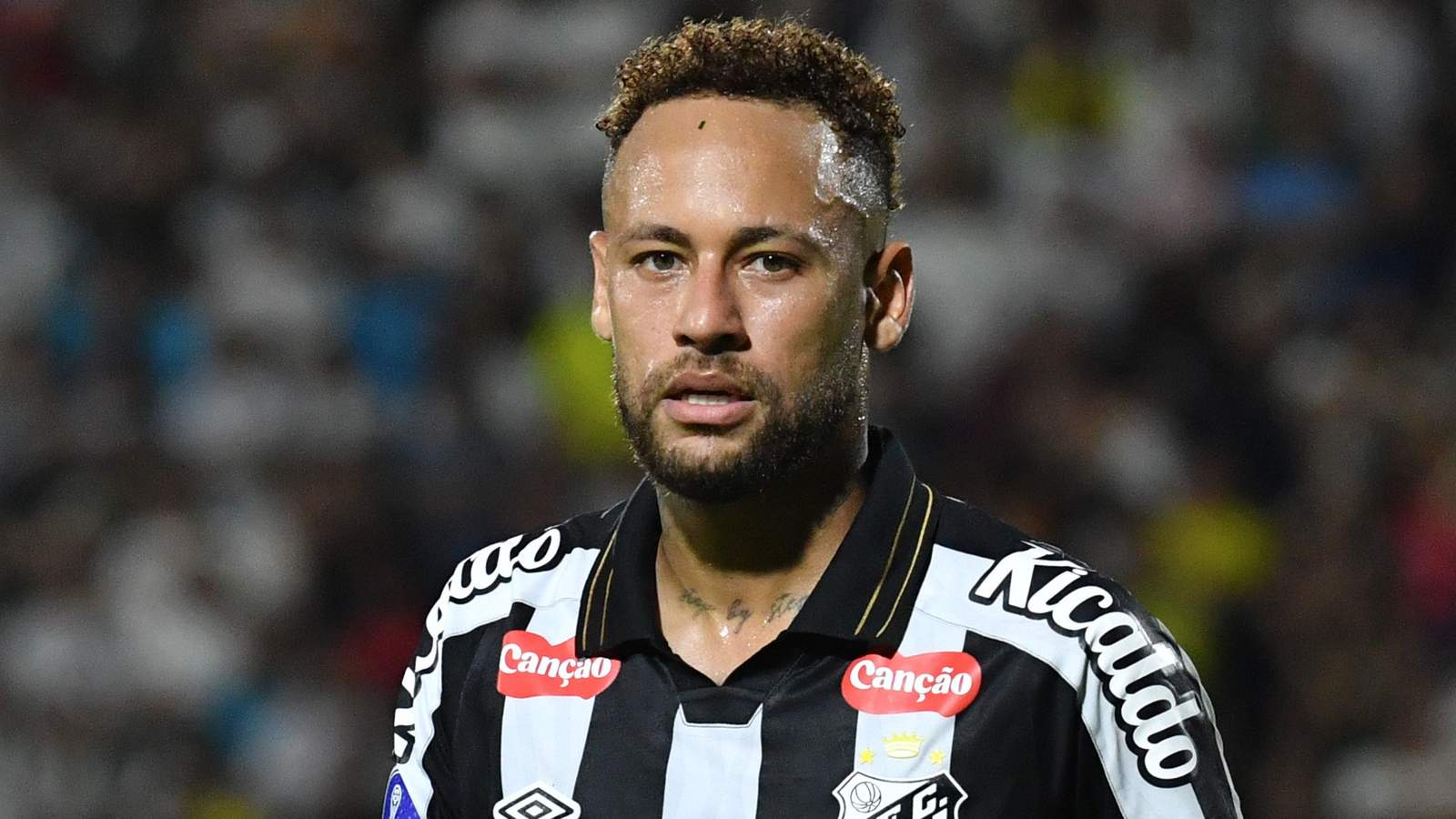 Close up portrait of Brazilian footballer Neymar wearing a black and white Santos jersey