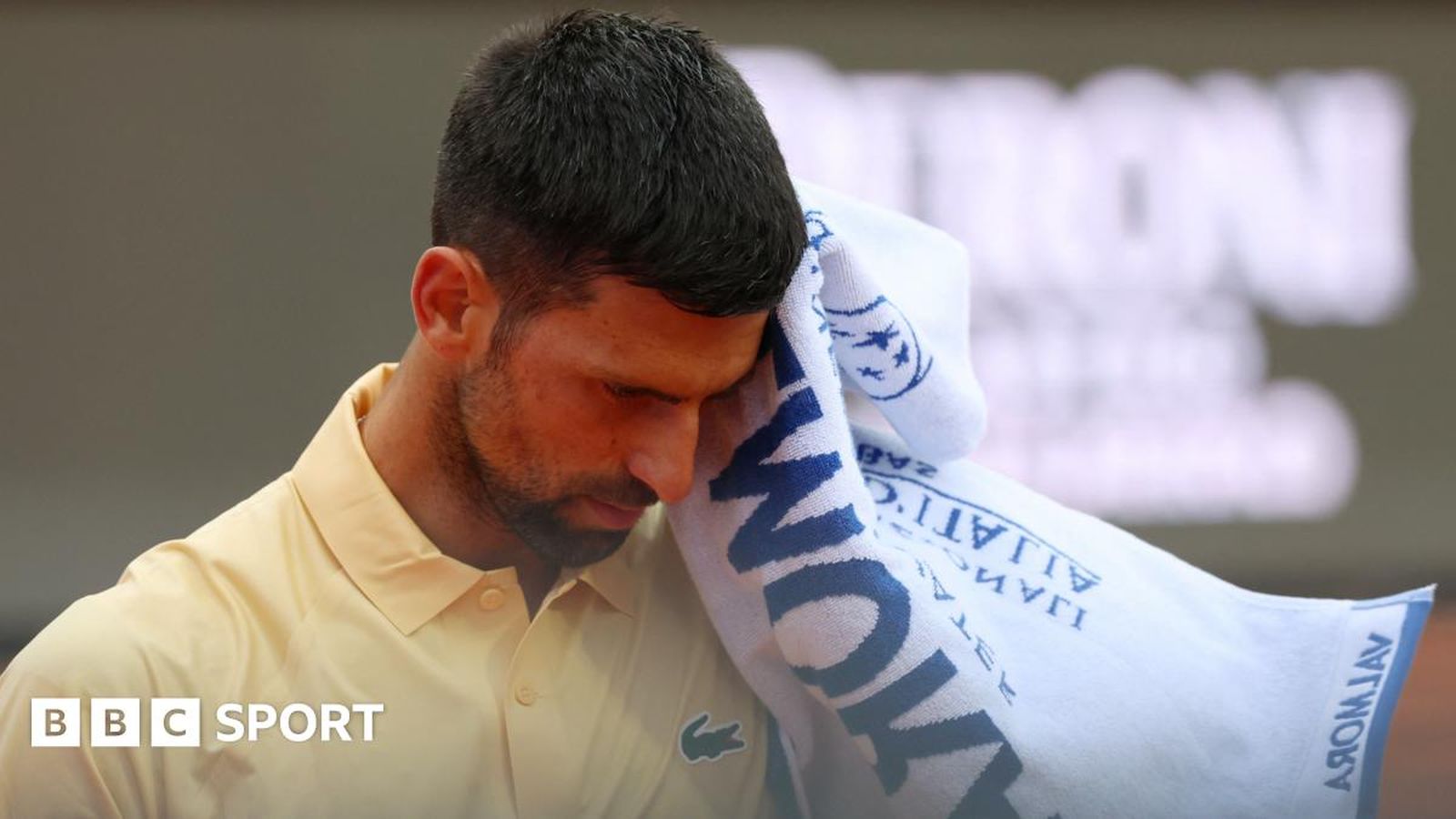 Novak Djokovic leaning on knees during match