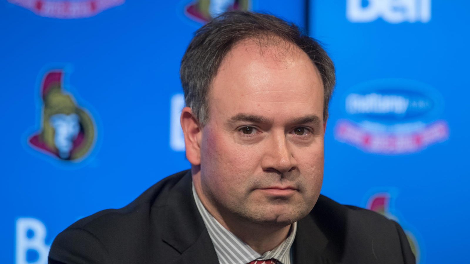 Former Ottawa Senators general manager Pierre Dorion speaking at a press conference
