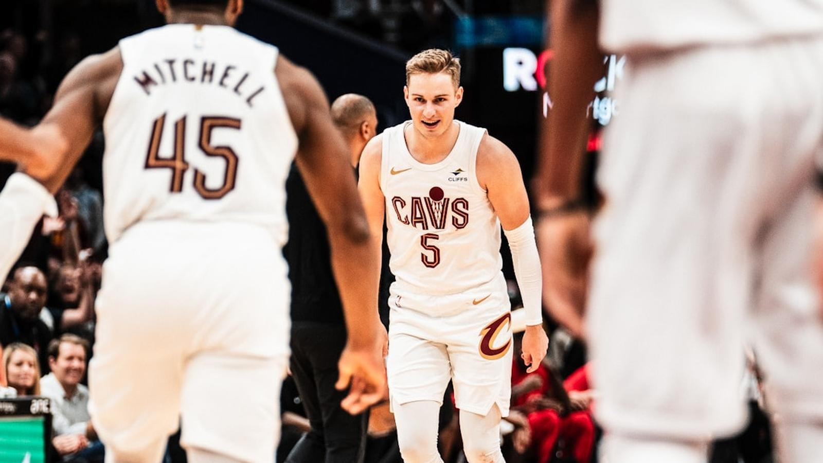 Sam Merrill wearing a white Cleveland Cavaliers jersey on the basketball court