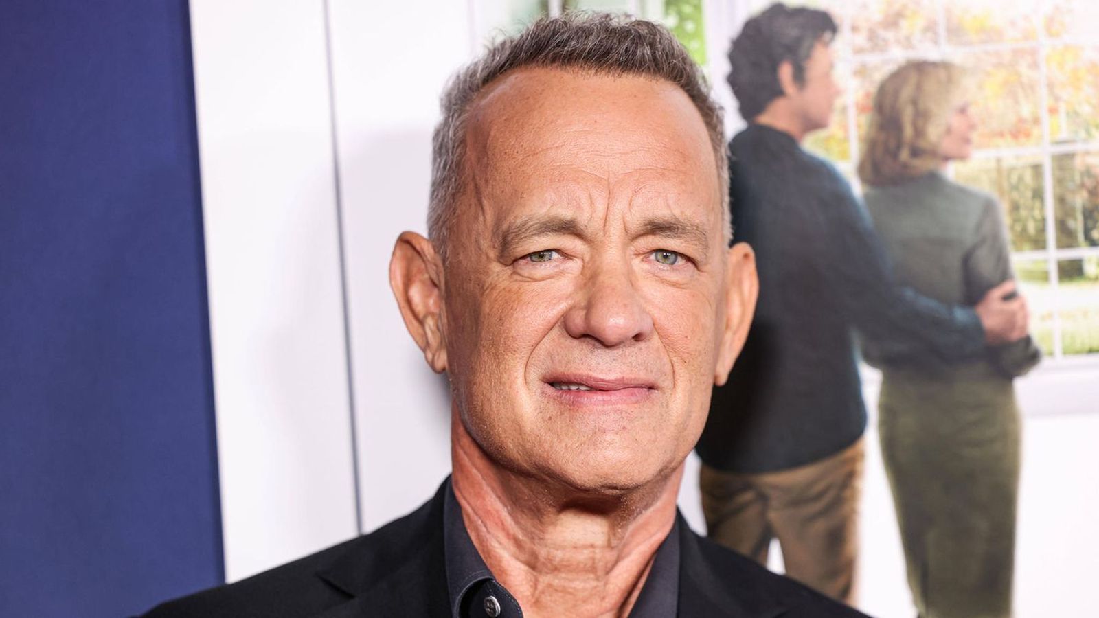 Close up portrait of actor Tom Hanks smiling at a public event