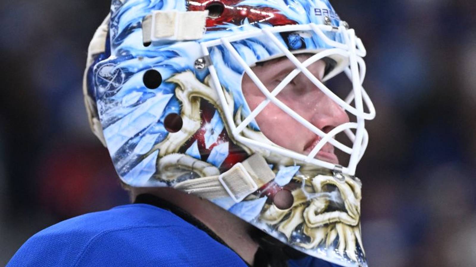 Buffalo Sabres goaltender Ukko-Pekka Luukkonen wearing his custom ice-themed goalie mask