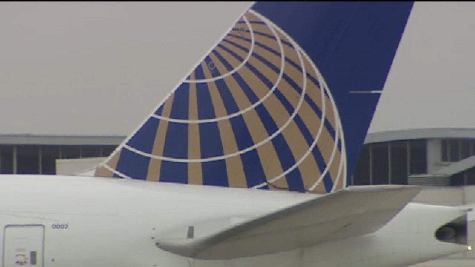 Close up view of a United Airlines aircraft tail fin at an airport
