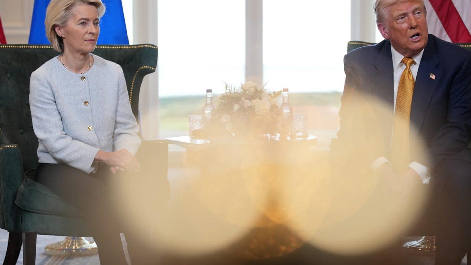 Ursula von der Leyen and Donald Trump sitting in chairs during a formal meeting