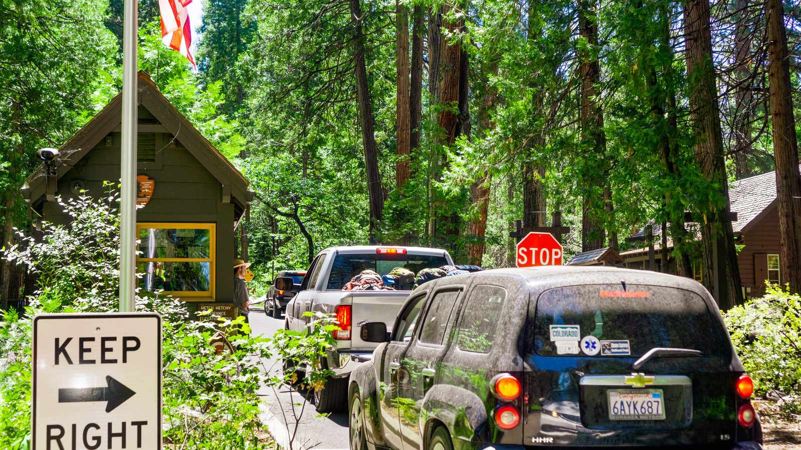 Cars waiting in a long line at the Yosemite National Park entrance station