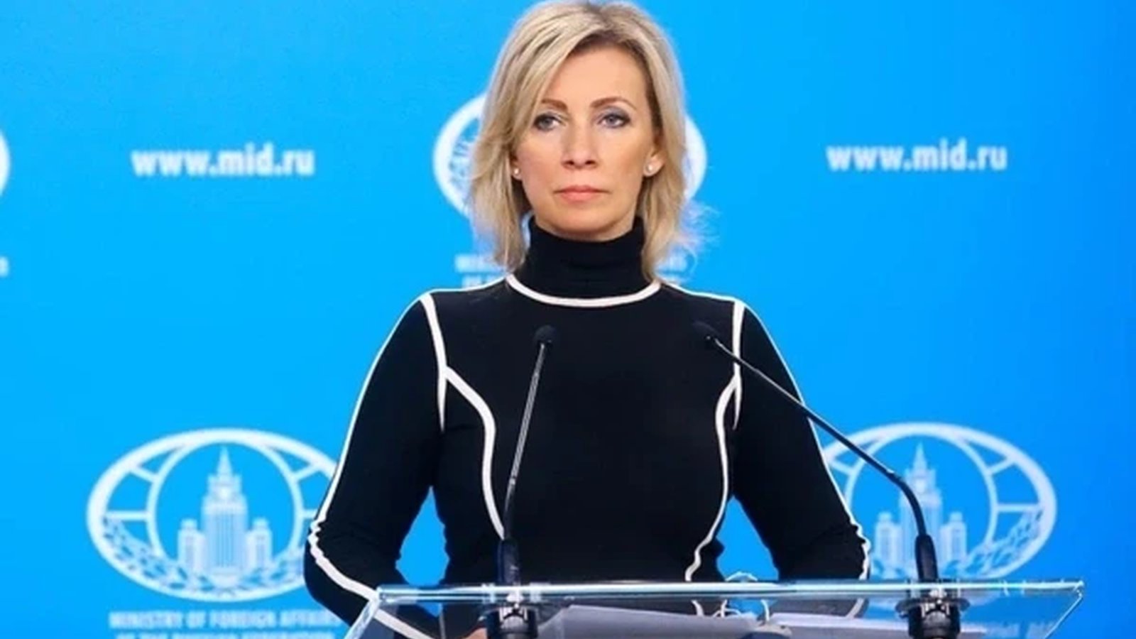 Russian Foreign Ministry spokesperson Maria Zakharova speaking at a press conference podium