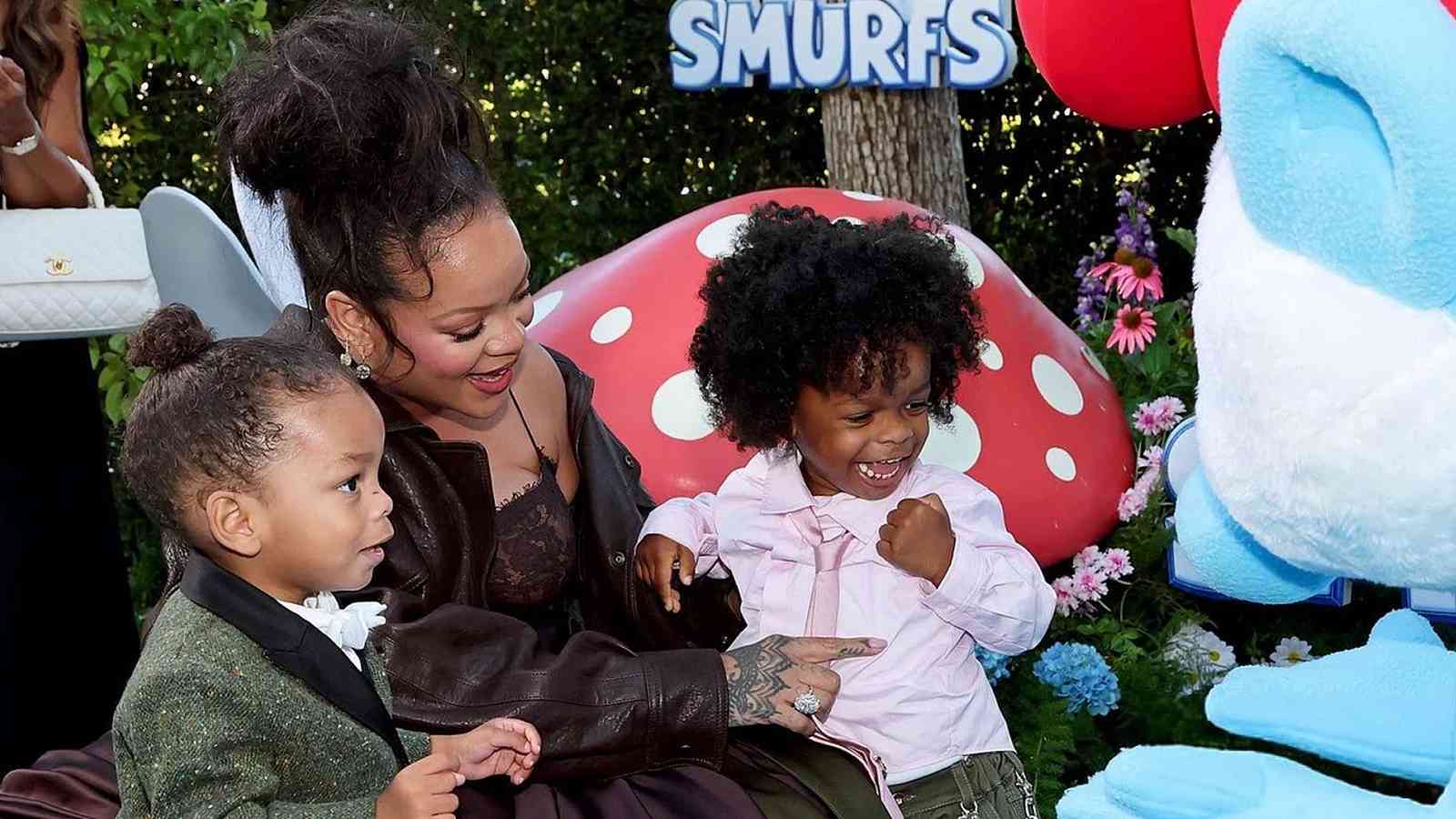 Rihanna, glowing in her third pregnancy, made a stunning appearance at the Smurfs movie premiere with her two sons, RZA and Riot, in Los Angeles. The event showcased her evolving role as a mother and artist.