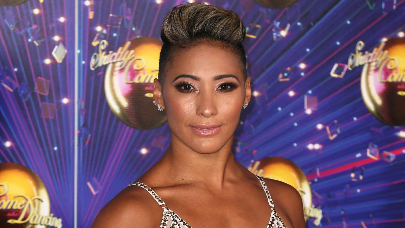 Karen Hauer, veteran Strictly Come Dancing professional, has candidly admitted the infamous 'Strictly curse' is real, offering rare insight into the show's backstage dynamics just as fellow dancer Joanne Clifton announces her engagement, sparking waves of support and reflection across the ballroom community.
