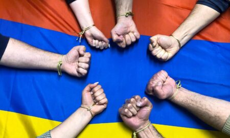 fists and Armenian flag