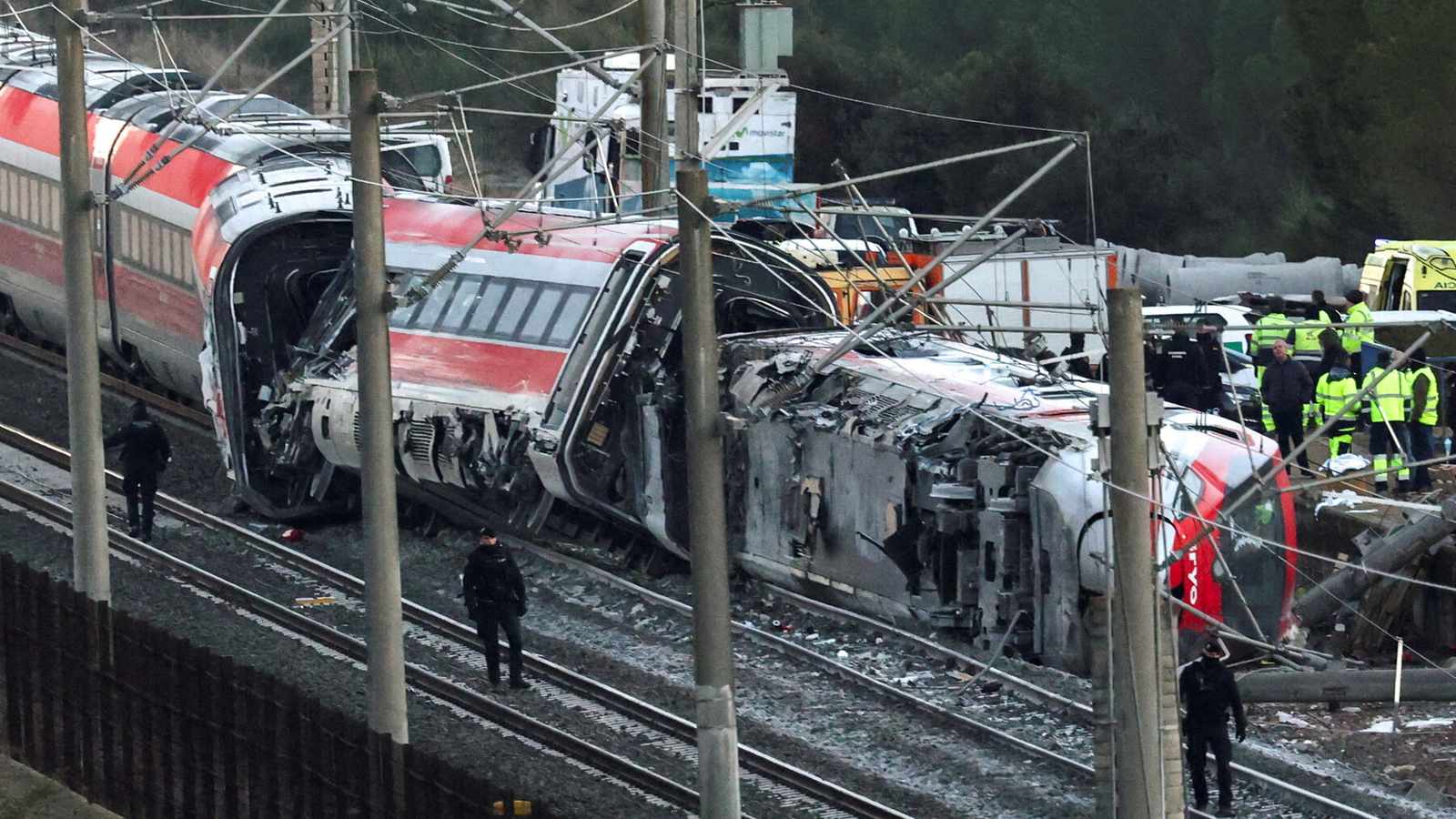 Damaged train carriages after derailment