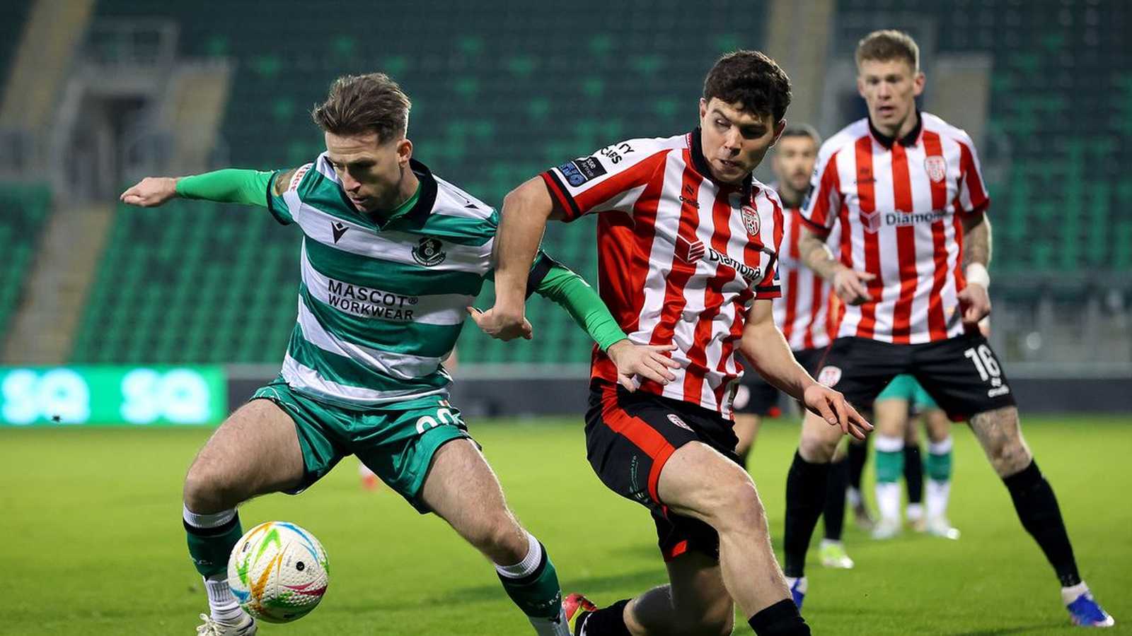 Derry City football players celebrating a goal